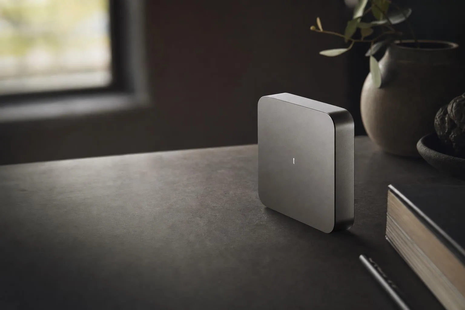 The device resting on a workbench at dusk